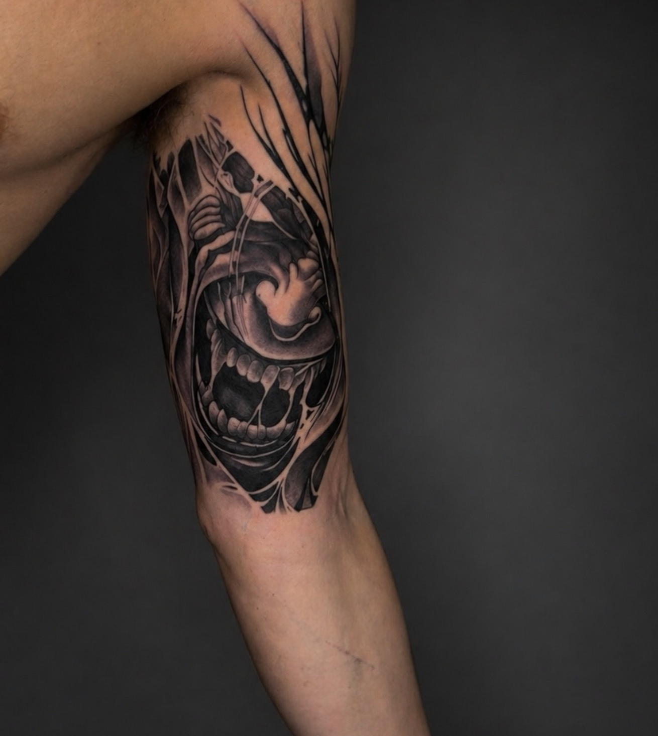 Dark creature portrait with sharp teeth and extended claws.
